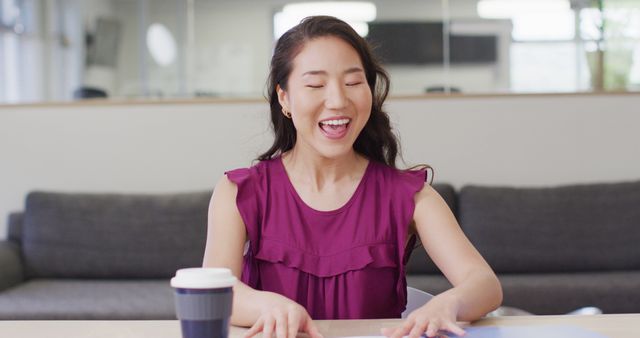 Happy asian woman having video call at office. Business, corporation, working in office and cooperation concept.