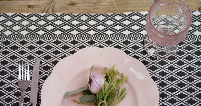 Elegant table setting with pink plate and floral arrangement - Download Free Stock Images Pikwizard.com