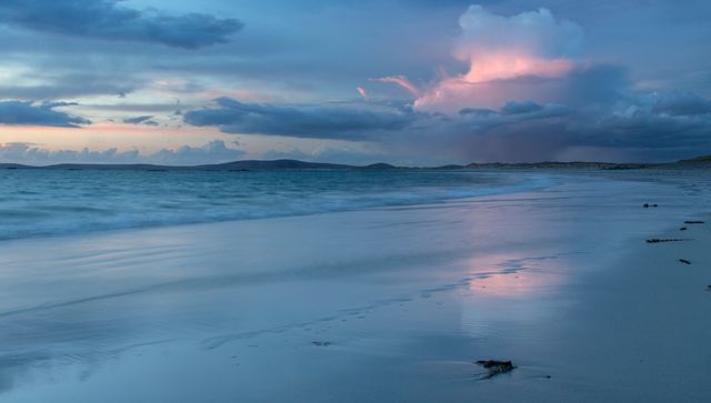 Tranquil Beach Scene with Waves, Clouds, and Sunset Reflections - Download Free Stock Photos Pikwizard.com