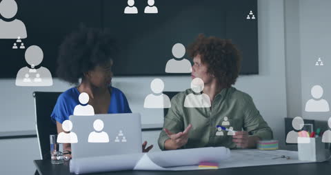 Diverse Colleagues Discussing with Social Media Icons Overlay