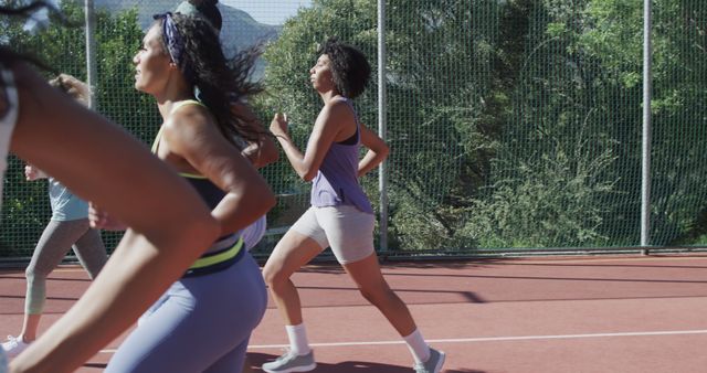 Women Jogging at Outdoor Track on Sunny Day - Download Free Stock Images Pikwizard.com