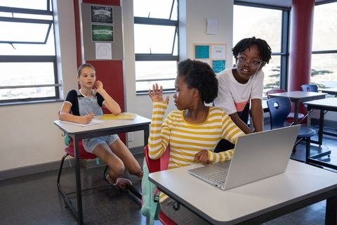 Diverse Students Engaging in Modern Classroom with Technology Use