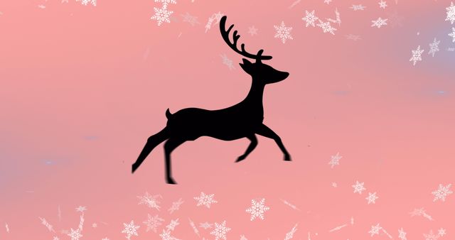 Silhouetted Reindeer Against Snowy Pink Background - Download Free Stock Images Pikwizard.com