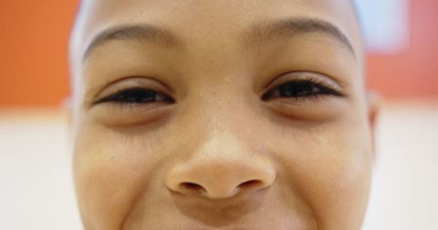 Joyful Boy Close-Up Portrait Against Vibrant Background
