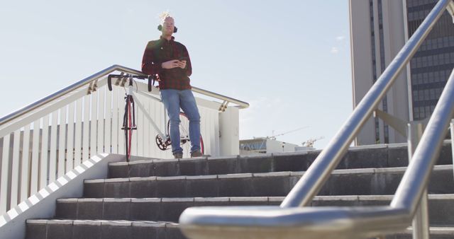 Modern Digital Nomad with Headphones Relaxing on City Steps - Download Free Stock Images Pikwizard.com