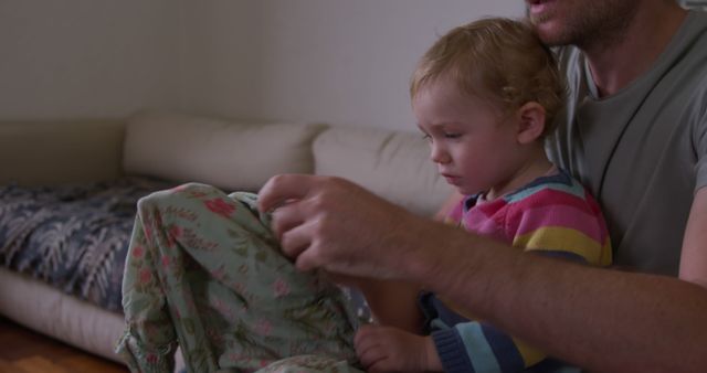 Father Comforting Young Toddler at Home in Living Room - Download Free Stock Images Pikwizard.com