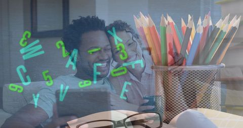 Couple Engaging with Technology in Creative Environment