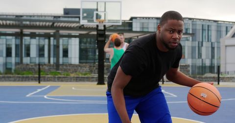 Basketball Player Dribbling on Outdoor Court Action