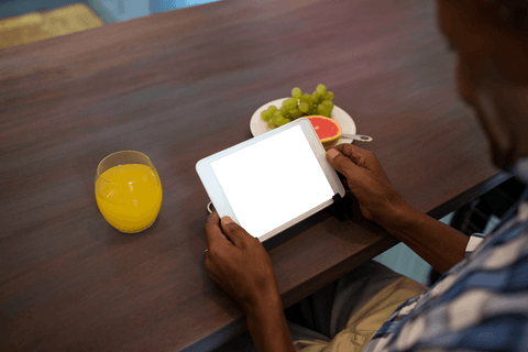man using tablet at wooden table with transparent screen and breakfast - Download Free Stock Videos Pikwizard.com