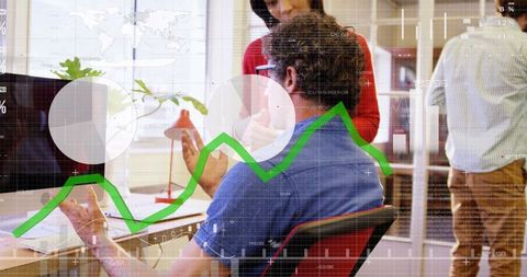 Business analyst discussing financial trends in modern office