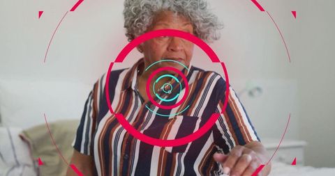 Senior Woman Interacting with Augmented Reality in Bedroom