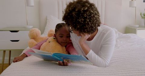 Mother and Child Reading a Picture Book Together