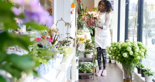 Florist Arranging Flower Bouquets in Shop Near Large Windows - Download Free Stock Images Pikwizard.com