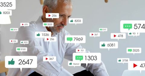 Senior man scanning social media notifications on laptop with engagement metrics overlay