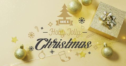 Sparkling holly jolly christmas flatlay with gold gift box and glitter baubles