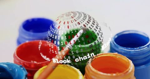Painting blockchain globe with vibrant acrylics among colorful open paint jars