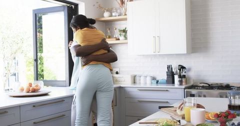 Romantic Breakfast Embrace in Modern Kitchen