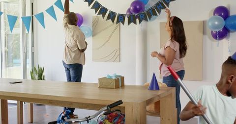 Preparing for a Birthday Celebration with Balloons and Decor