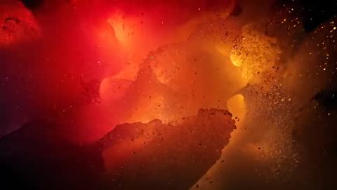 Shifting Glowing Pigment Clouds Expanding into Yellow Core — Macro Liquid Reaction Video