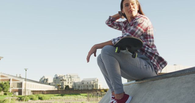 Young Woman Posing with Skateboard in Urban Skatepark - Download Free Stock Images Pikwizard.com