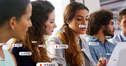 Colleagues Analyzing Data with Digital Connections in Office