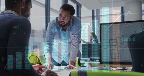 Business Team Engaged in Data-Driven Discussion in Modern Office