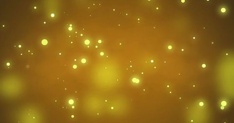 Glowing Yellow Light Particles on Warm Background - Download Free Stock Images Pikwizard.com