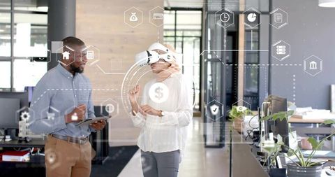 Colleagues Exploring Innovative Technology Solutions in Modern Office