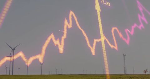 Windfarm powering clean energy growth with neon financial chart overlay and rural fields