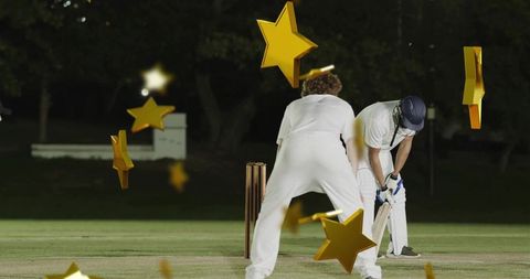 Night cricket match under floodlights batsman at crease with gold star overlay celebrating