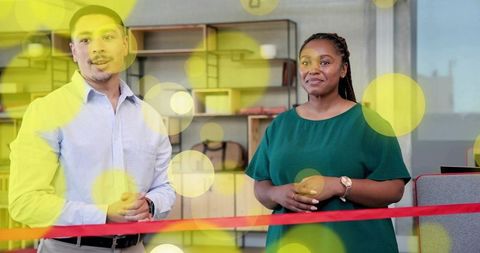 Cutting ribbon at modern office opening, colleagues celebrating new workspace launch