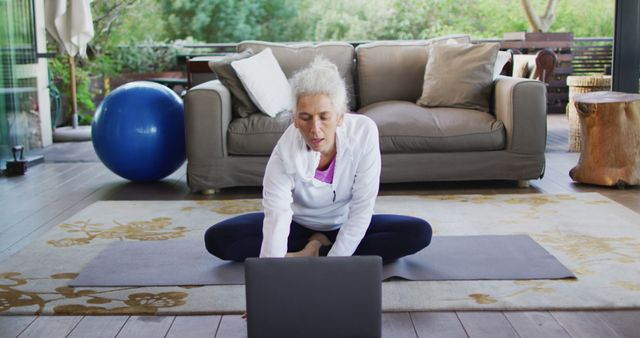 Senior Woman Doing Yoga Practice on Laptop at Home - Download Free Stock Images Pikwizard.com