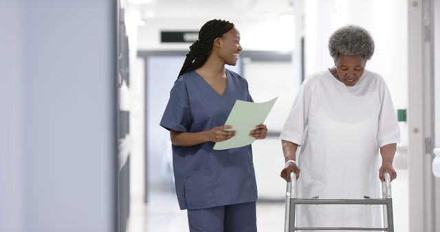 Nurse Assisting Elderly Woman with Walker in Hospital Corridor - Download Free Stock Images Pikwizard.com