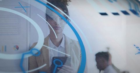 Businesswoman Reviewing Digital Dashboard on Tablet Behind Glass with Augmented Interface