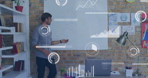 Businessman Analyzing Data Projections in Office Meeting - Download Free Stock Images Pikwizard.com