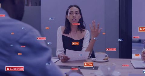 Female presenter gesturing in boardroom with social media engagement overlays and metrics