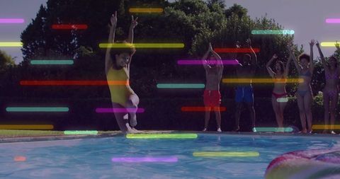 Friends celebrating pool party jumping into backyard pool with neon light streaks