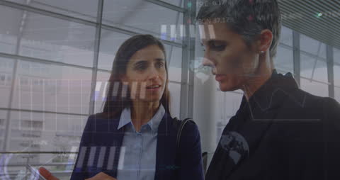 Business Analytics: Two Professionals Analyzing Data Trends