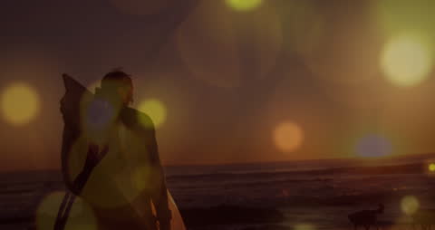 Surfer Silhouette at Sunset with Artistic Light Effects