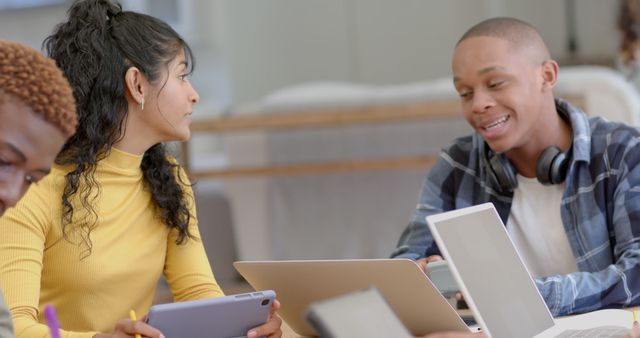 Diverse Students Collaborating in Study Session on Laptops and Tablets - Download Free Stock Images Pikwizard.com