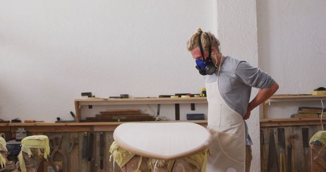 Craftsman Carving Surfboard in Workshop - Download Free Stock Images Pikwizard.com