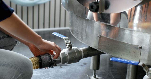 Technician Adjusting Industrial Valve in Brewery - Download Free Stock Images Pikwizard.com