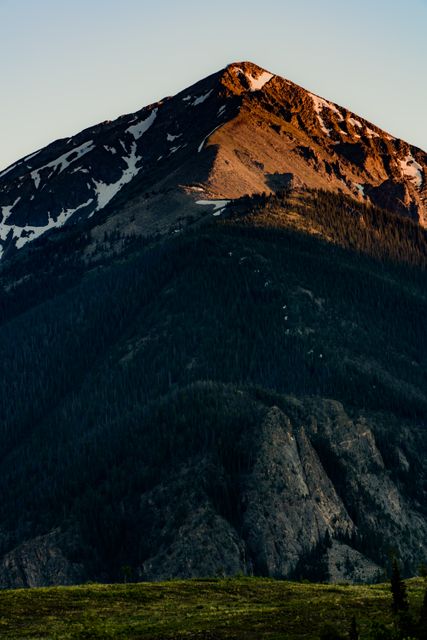 Majestic Mountain Peak at Sunset with Snowy Slopes - Download Free Stock Photos Pikwizard.com
