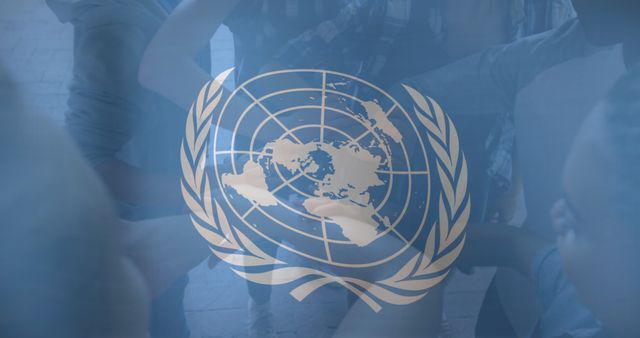 Empowering Global Unity with Interlocked Hands and UN Symbol - Download Free Stock Images Pikwizard.com