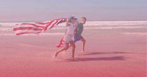 Joyful Siblings Celebrating with American Flag on Beach - Download Free Stock Images Pikwizard.com