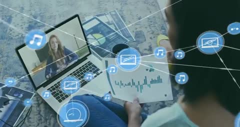 Remote professional collaborating on data review with laptop video call and media overlay