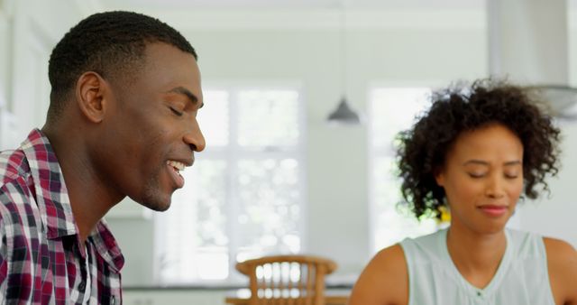 Black couple praying together at home - Download Free Stock Photos Pikwizard.com