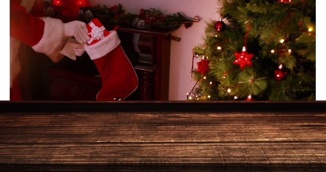 Digital composite of Wooden foreground with Christmas background of Santa bringing gifts to stocking