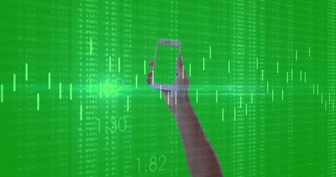 Holding smartphone over green financial data stream with candlestick charts and analytics