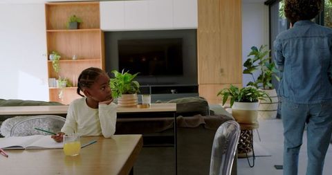 Daughter Doing Homework with Mother at Home